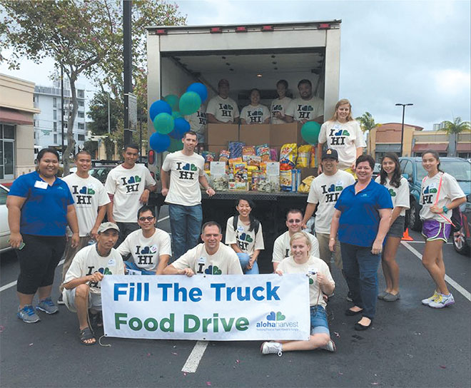 Kaiser High School's Interact Club and other volunteers helped to collect both food and money for Aloha Harvest at its annual ‘Fill the Truck' drive in February by Kapahulu Safeway store. The nonprofit has a unique mission to feed the hungry by ‘rescuing' food that would otherwise be wasted from stores and hotels. PHOTO FROM ALOHA HARVEST.