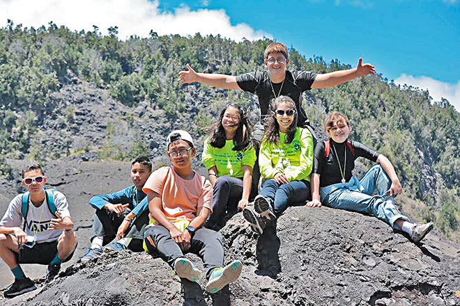 Star of the Sea students enjoy a rest stop in the crater while hiking Kilauea Iki trail at Hawaii Volcanoes National Park. They are (top) Angelo Rufo, (from left) Keenan Yoshikawa, Cole Kadoguchi, Jeong Mo Lee, Ely Redoble, Isabelle Gary and Maya Oda. PHOTO FROM CRISTINA VERESAN.