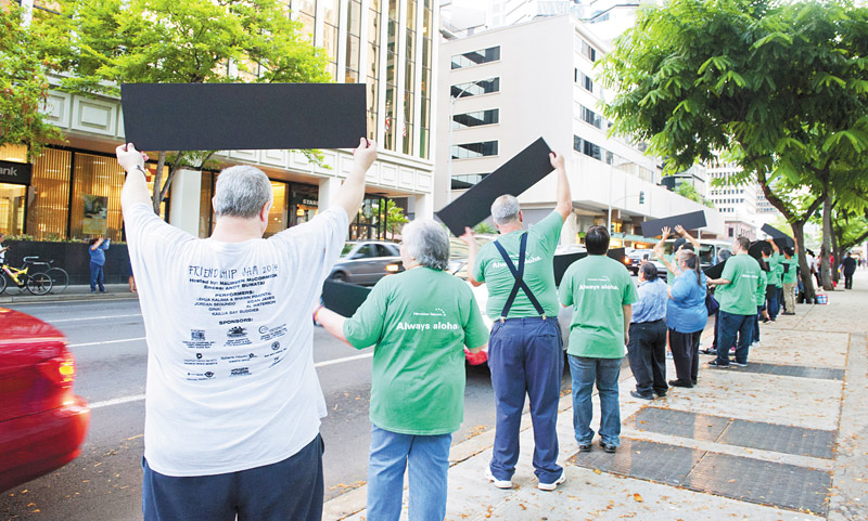 AUW supporters took their message to motorists downtown