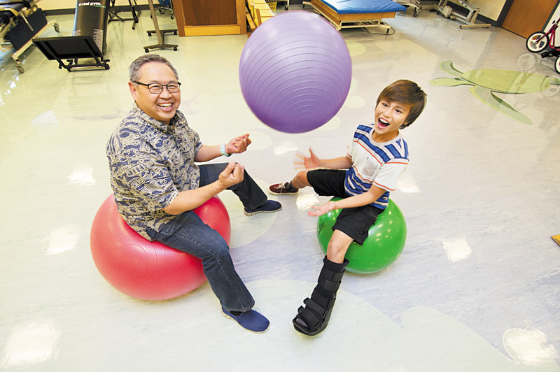 Injuries happen to young athletes, and when they do, Shriners has opened a one-stop clinic that offers diagnosis, treatment and rehab. Pictured are Dr. Craig Ono and skateboarder Jonathan Lau