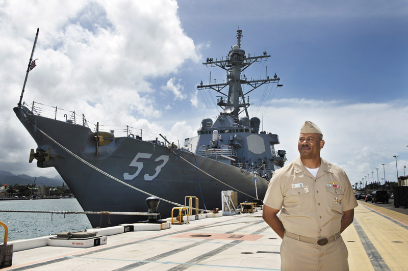 Rear Adm. John Fuller beside the USS John Paul Jones  