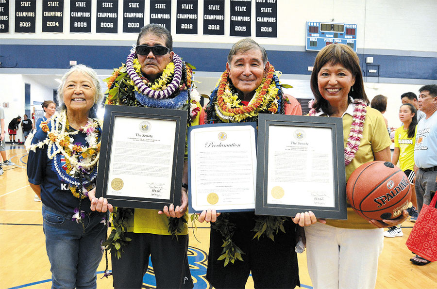 State Sen. Donna Mercado Kim (far right) presented proclamations to coaches Dennis Agena (second from left) and Myles Akamine of Kalakaua Basketball Clinic, pictured with Leilani Agena PHOTO BY DUANE IKEDA