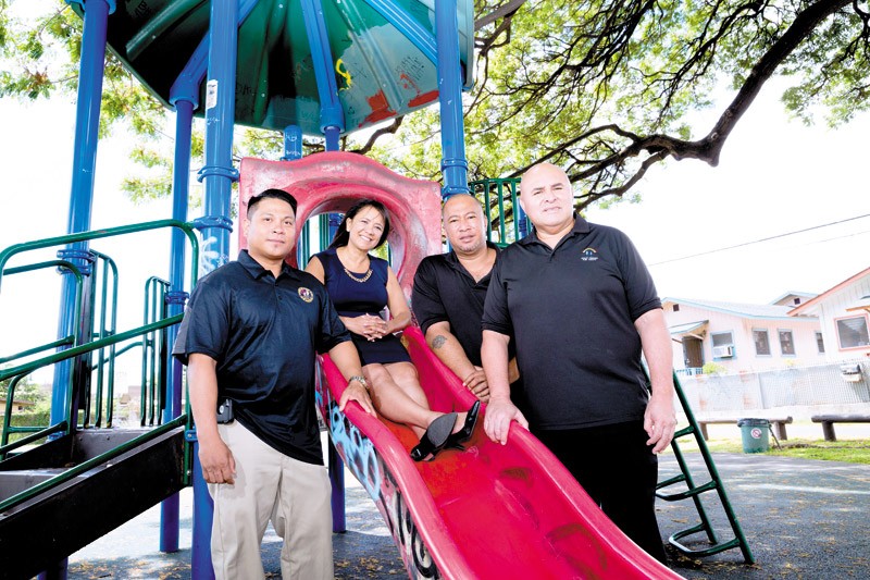 Adult Friends for Youth's (from left) Rowel Yasay, president and CEO Deborah Spencer-Chun, Malakai Maumalanga and vice president Mac Schwenke at Kanoa Park in Kalihi 