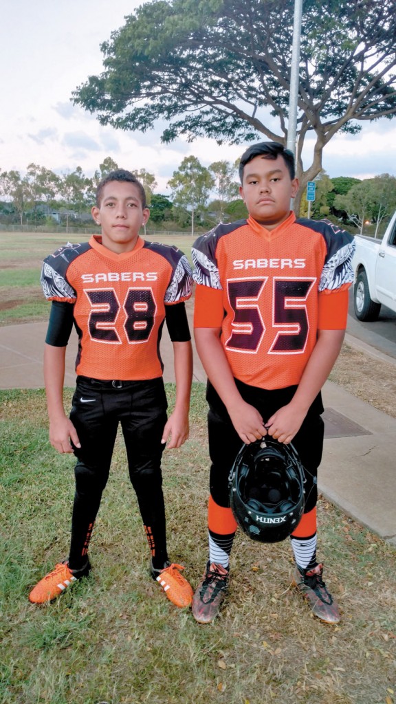 Tahj Hauhio and Keolu Evaimalo (both age 13) on picture-taking day for the Ewa Beach Sabers DI Red team.