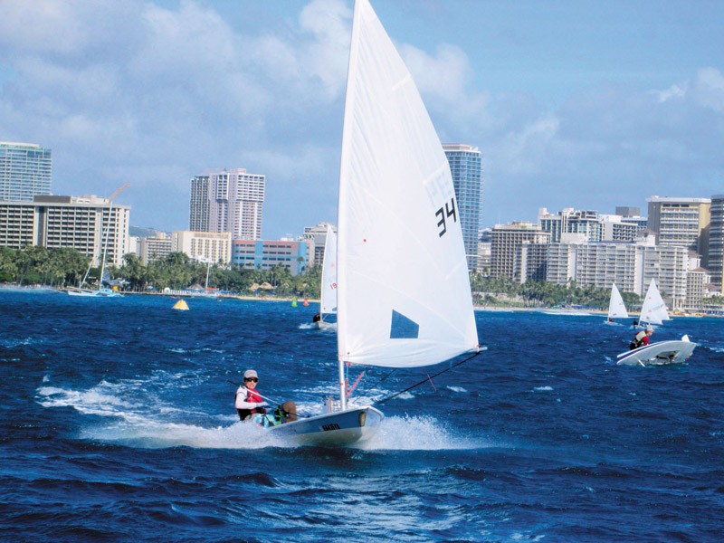 Max Roth (age 14) racing in the Duke Kahanamoku laser sailboat regatta off Waikiki Oct. 1. Photo by Guy Fleming, Waikiki Yacht Club Youth Sailing coach.