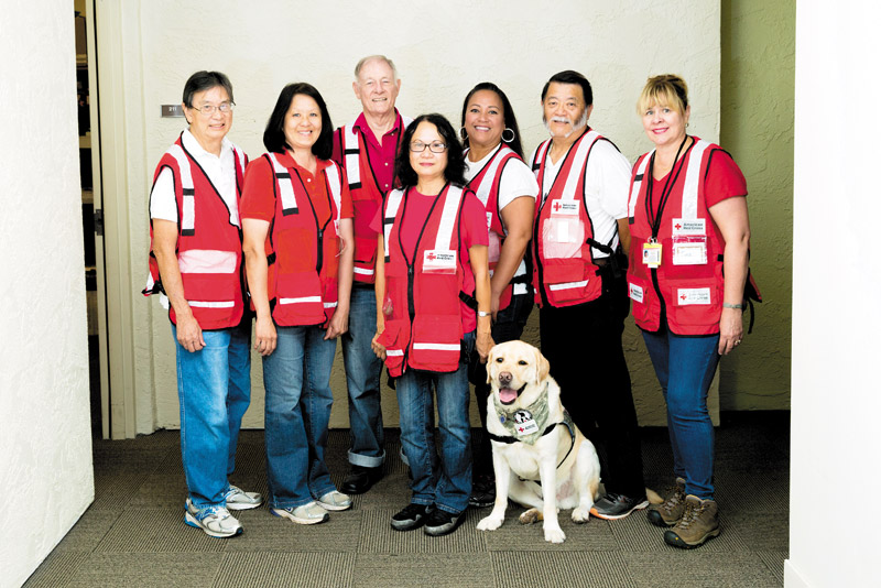 Current American Red Cross of Hawaii volunteers (from left) Wes and Shari Ching, Ray Moody, Millie Griggs and service dog Ollie, Renise Bayne, Ken Aoki and Tina Doty 