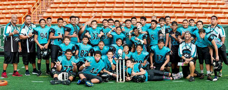 The KapCity Hurricanes 15U team (majority of their players are from the Kapolei area) celebrate their win in the 2016 fall season D1 White championship in the JPS football league