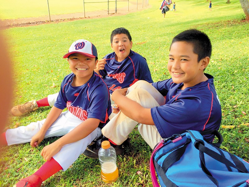 Cousins that make one-fourth of the team: (from left) Jordan Abreu (10), Micah Gomes (10) and Isaac Gomes (10), who play for the Mililani Nationals.