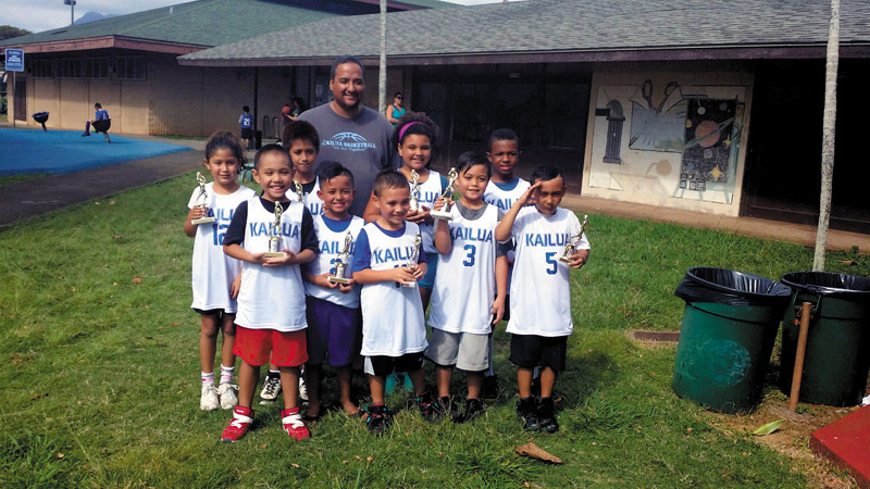The Warriors (age 7 and 8) celebrate the last game of their season in PAL (Police Activities League) at Kailua District Park