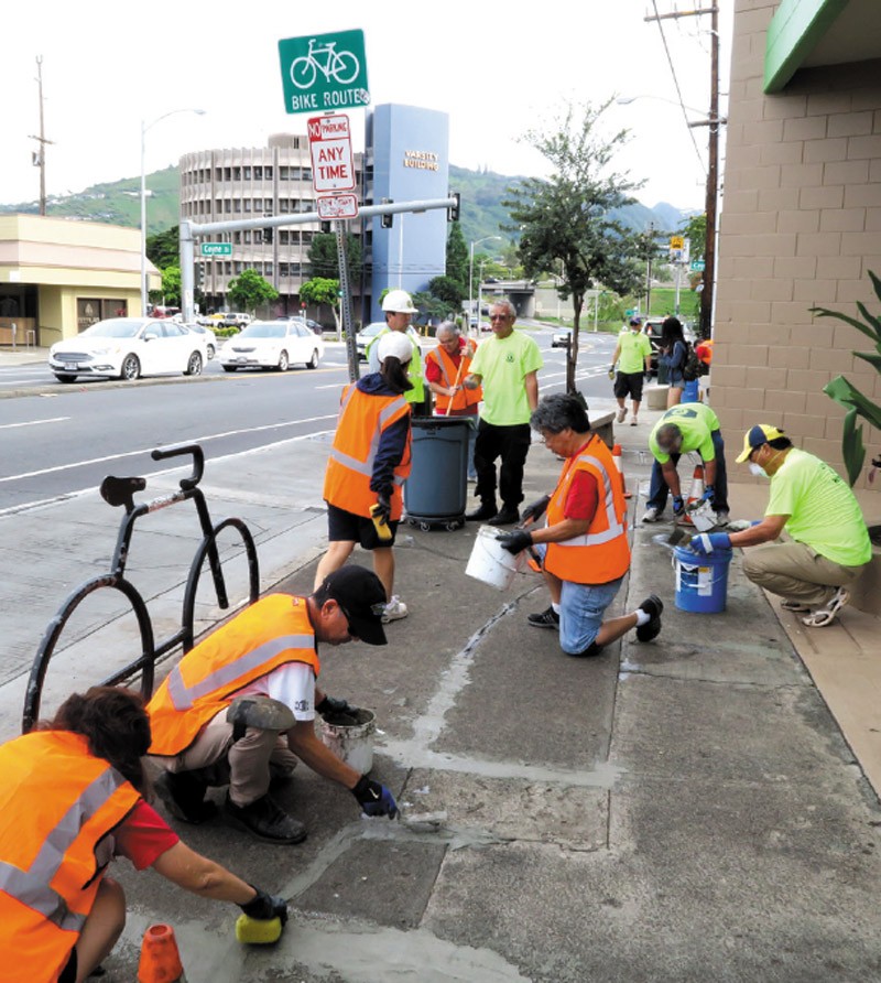 Lions Clubs members gather regularly to repair sidewalks for their Safe Sidewalks project PHOTO COURTESY DISTRICT 50 HAWAII LIONS 