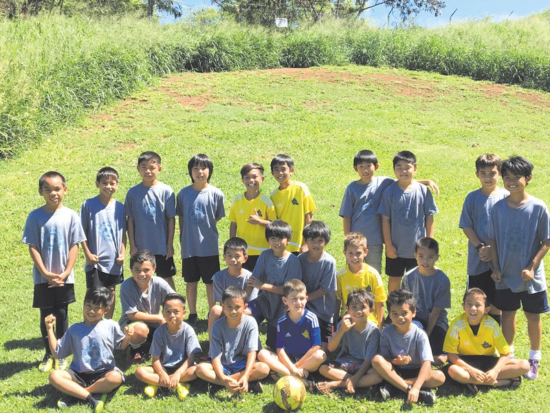 Players of Oahu United Soccer Club's 2007 Gold and Blue Teams along with its youngest group, the 2009 Gold team.